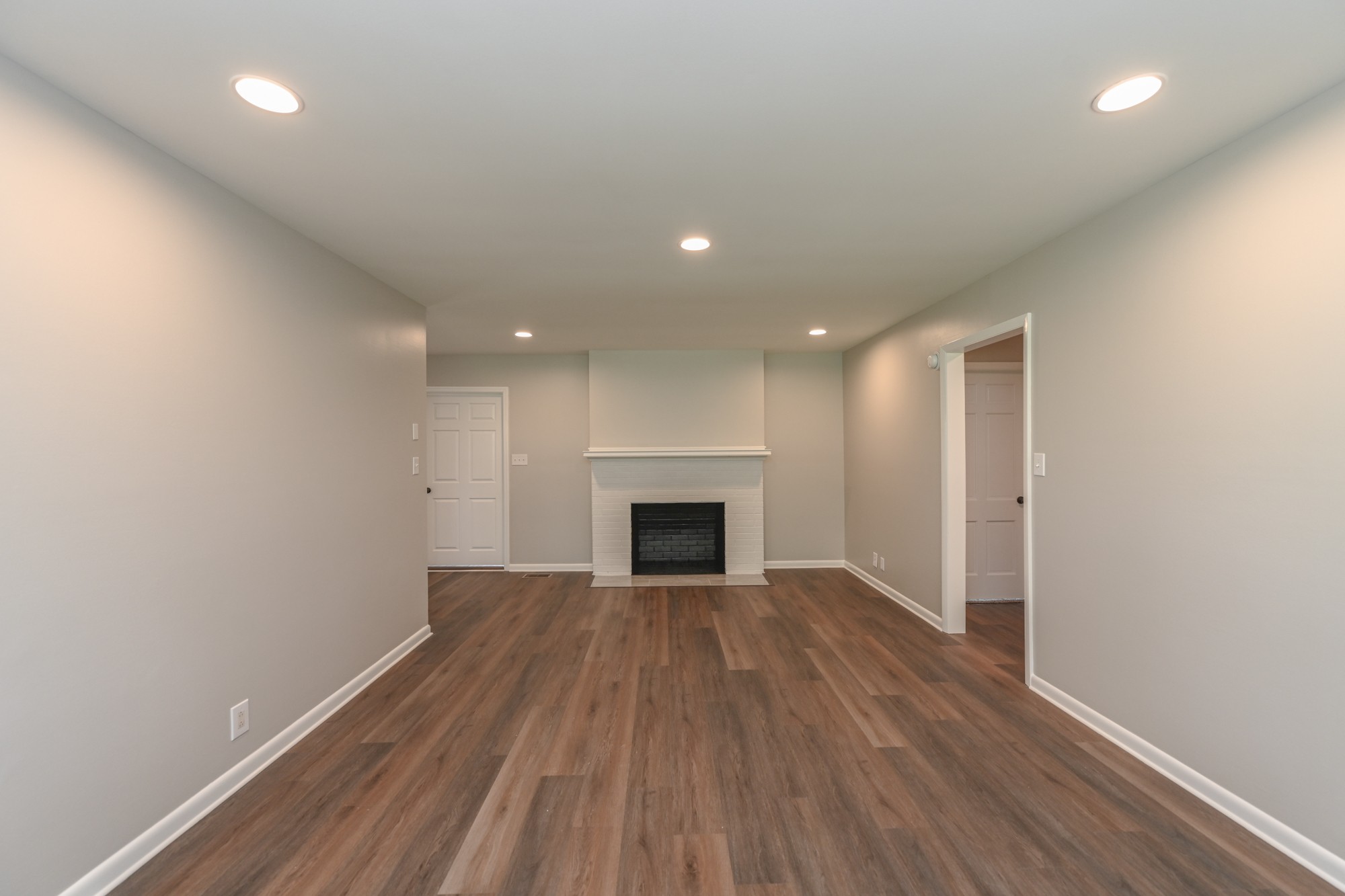 4334 Mt Zion Road Springfield, TN 37172 - Photo 2 of 52 an empty room with wooden floor and fireplace