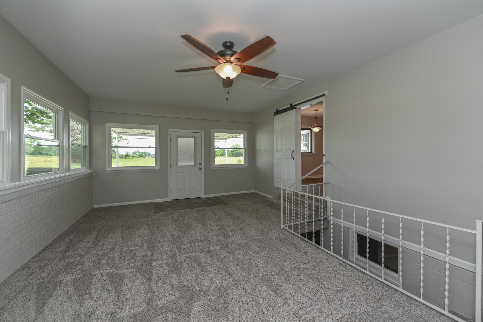 4334 Mt Zion Road Springfield, TN 37172 - Photo 23 of 52 a view of an empty room with window and chandelier fan
