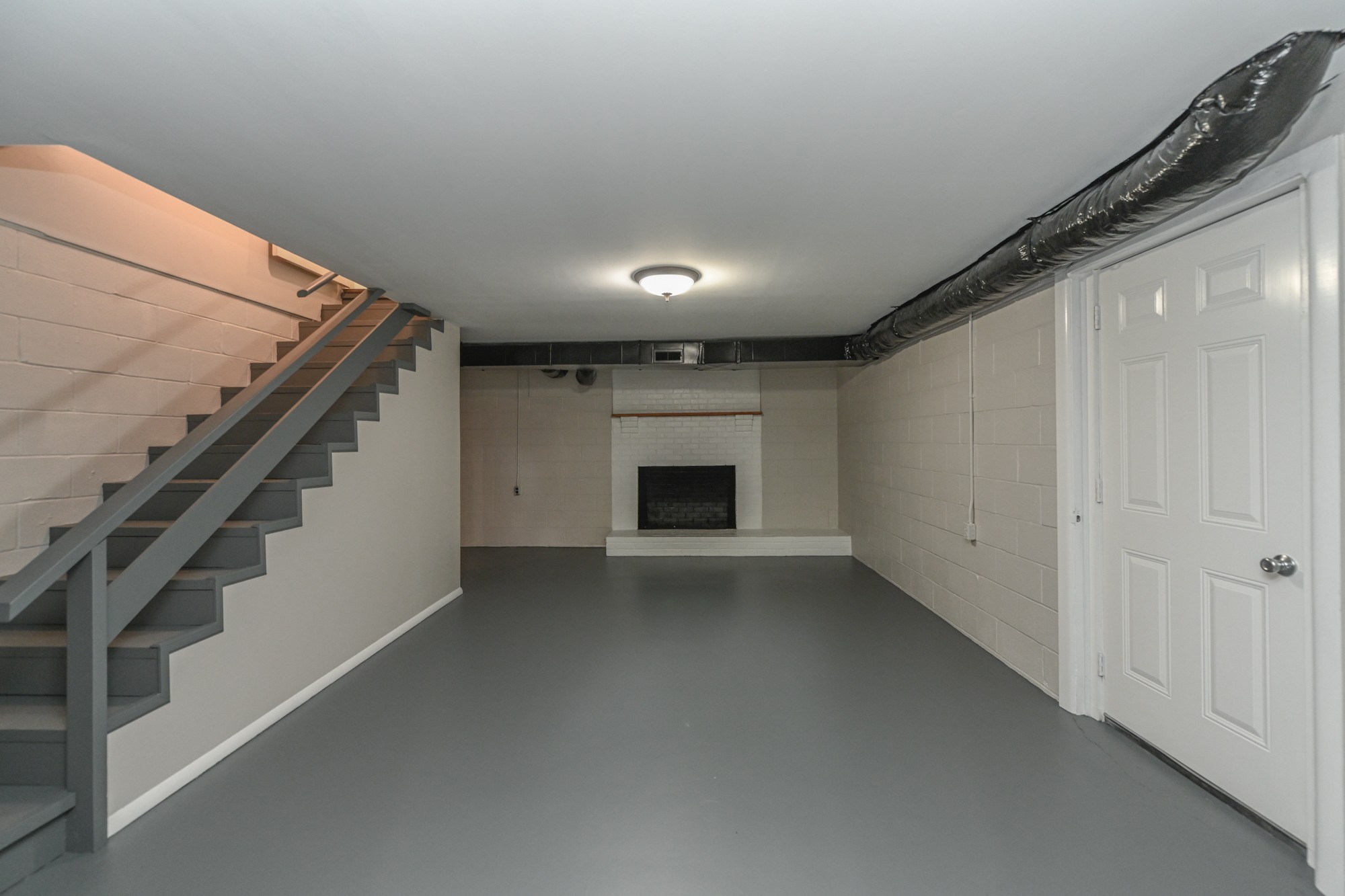 4334 Mt Zion Road Springfield, TN 37172 - Photo 26 of 52 a view of an empty room with a fireplace and a window