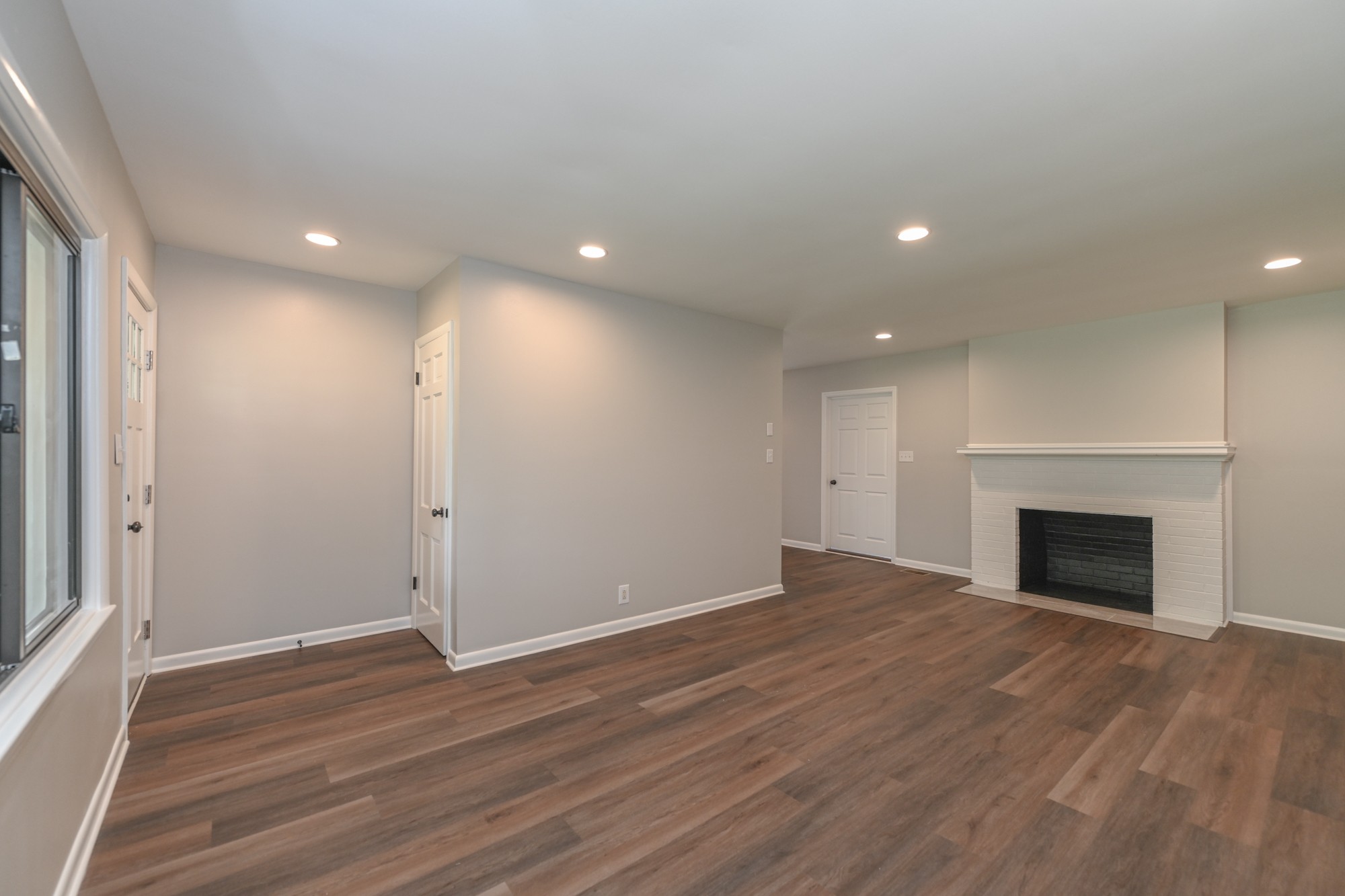 4334 Mt Zion Road Springfield, TN 37172 - Photo 3 of 52 an empty room with wooden floor and fireplace