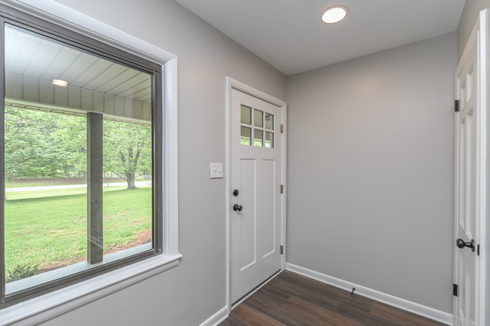 4334 Mt Zion Road Springfield, TN 37172 - Photo 38 of 52 a view of an empty room with wooden floor and a window