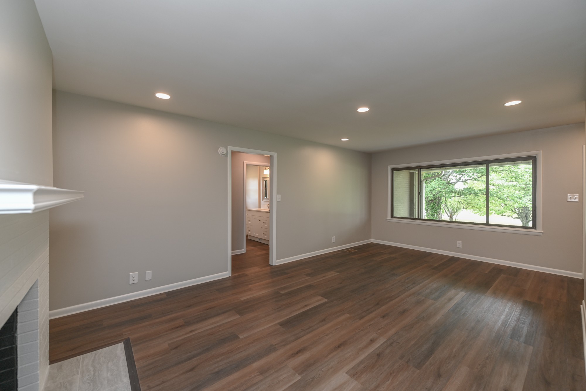 4334 Mt Zion Road Springfield, TN 37172 - Photo 5 of 52 an empty room with wooden floor and windows