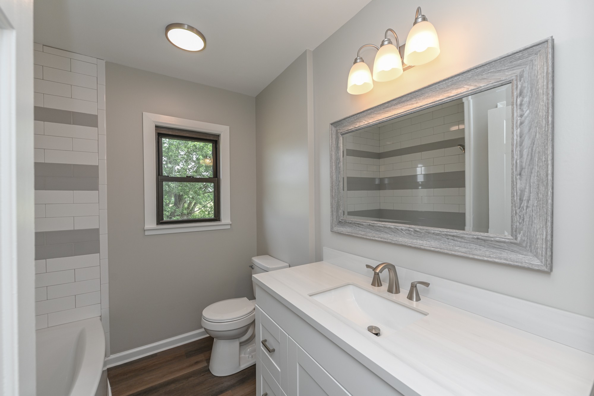 4334 Mt Zion Road Springfield, TN 37172 - Photo 7 of 52 a bathroom with a toilet a sink and mirror