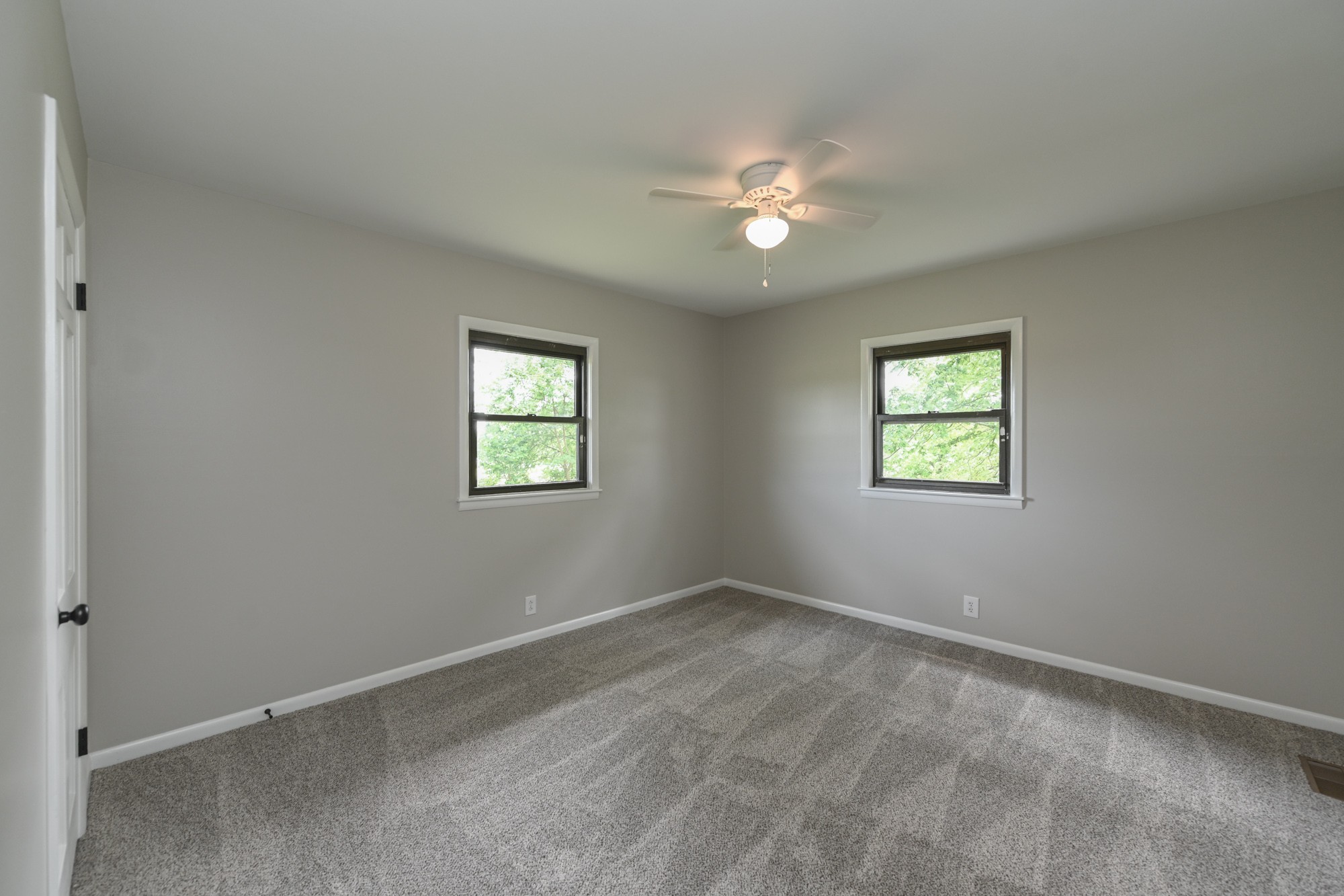 4334 Mt Zion Road Springfield, TN 37172 - Photo 9 of 52 an empty room with windows and fan