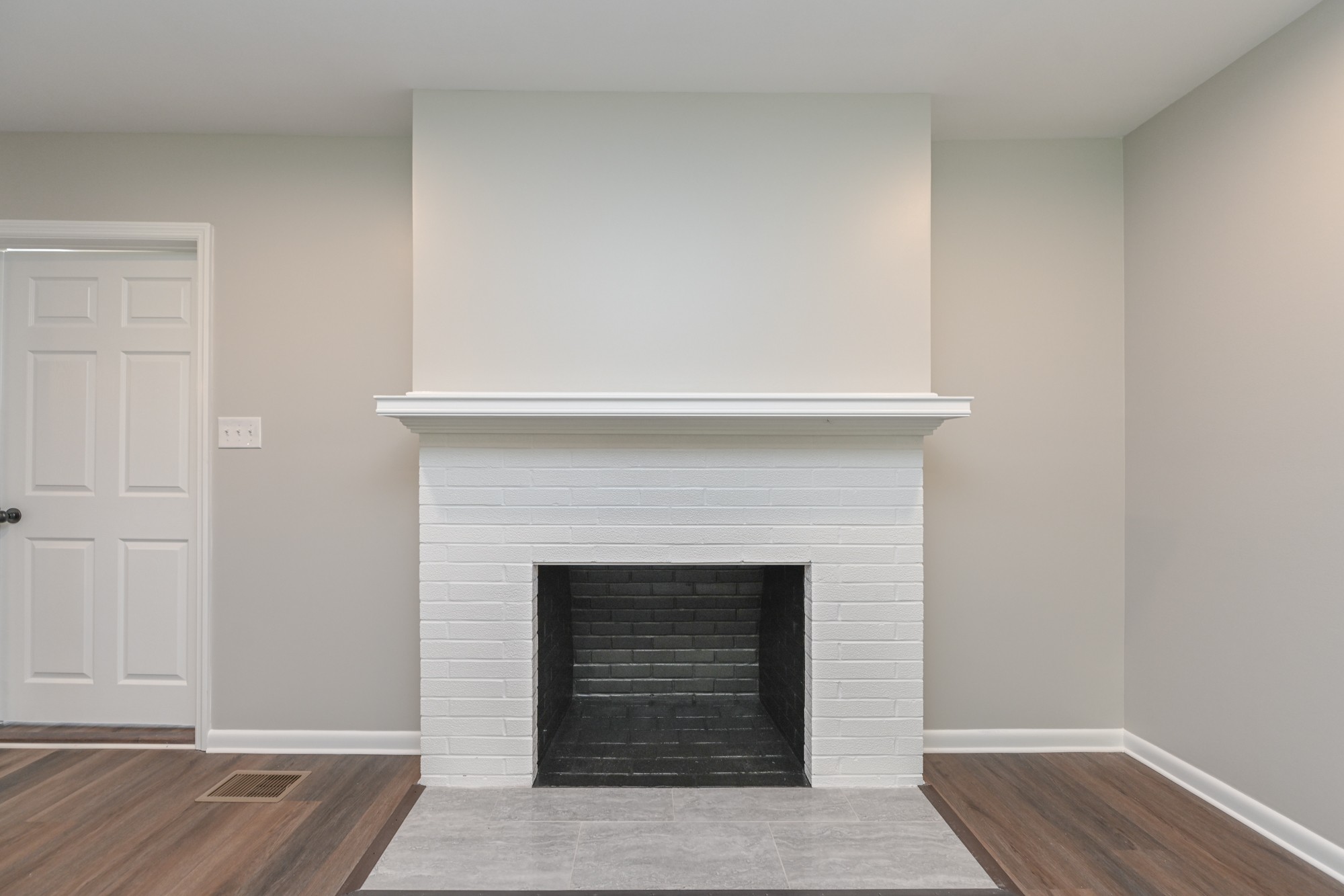 4334 Mt Zion Road Springfield, TN 37172 - Photo 10 of 52 a living room with a fireplace and a wooden floor