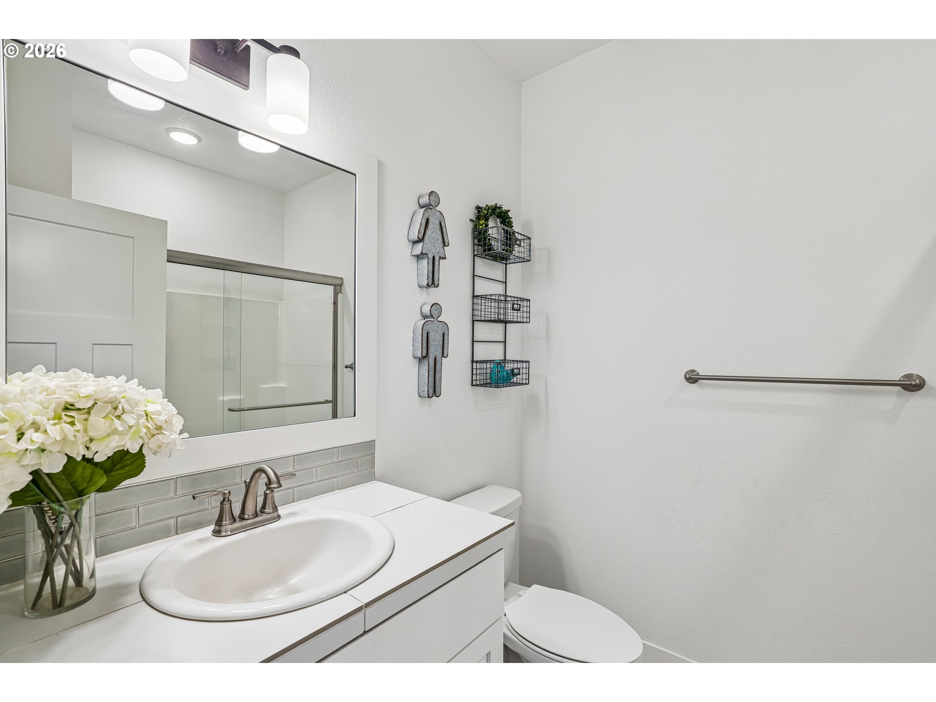 236 Northeast 17th Avenue Canby, OR 97013 - Photo 16 of 36 a bathroom with a sink toilet and mirror
