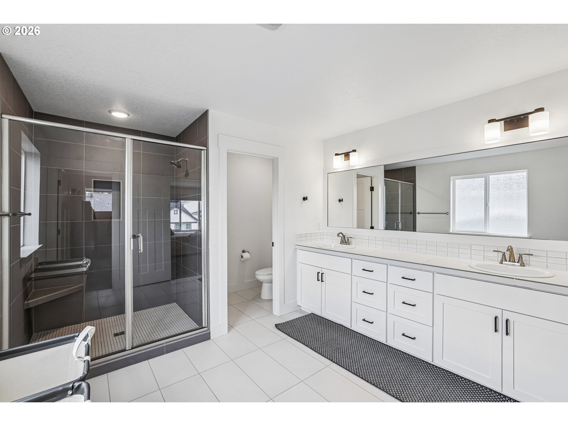 236 Northeast 17th Avenue Canby, OR 97013 - Photo 22 of 36 a bathroom with a double vanity sink mirror and shower