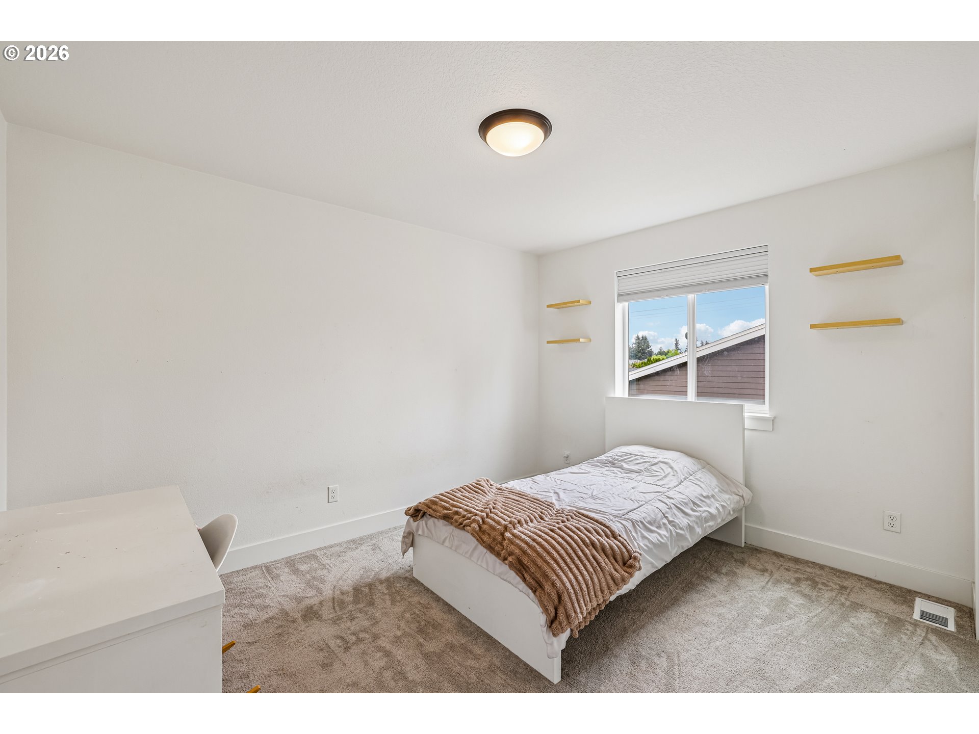 236 Northeast 17th Avenue Canby, OR 97013 - Photo 27 of 36 a bedroom with a bed and a lamp