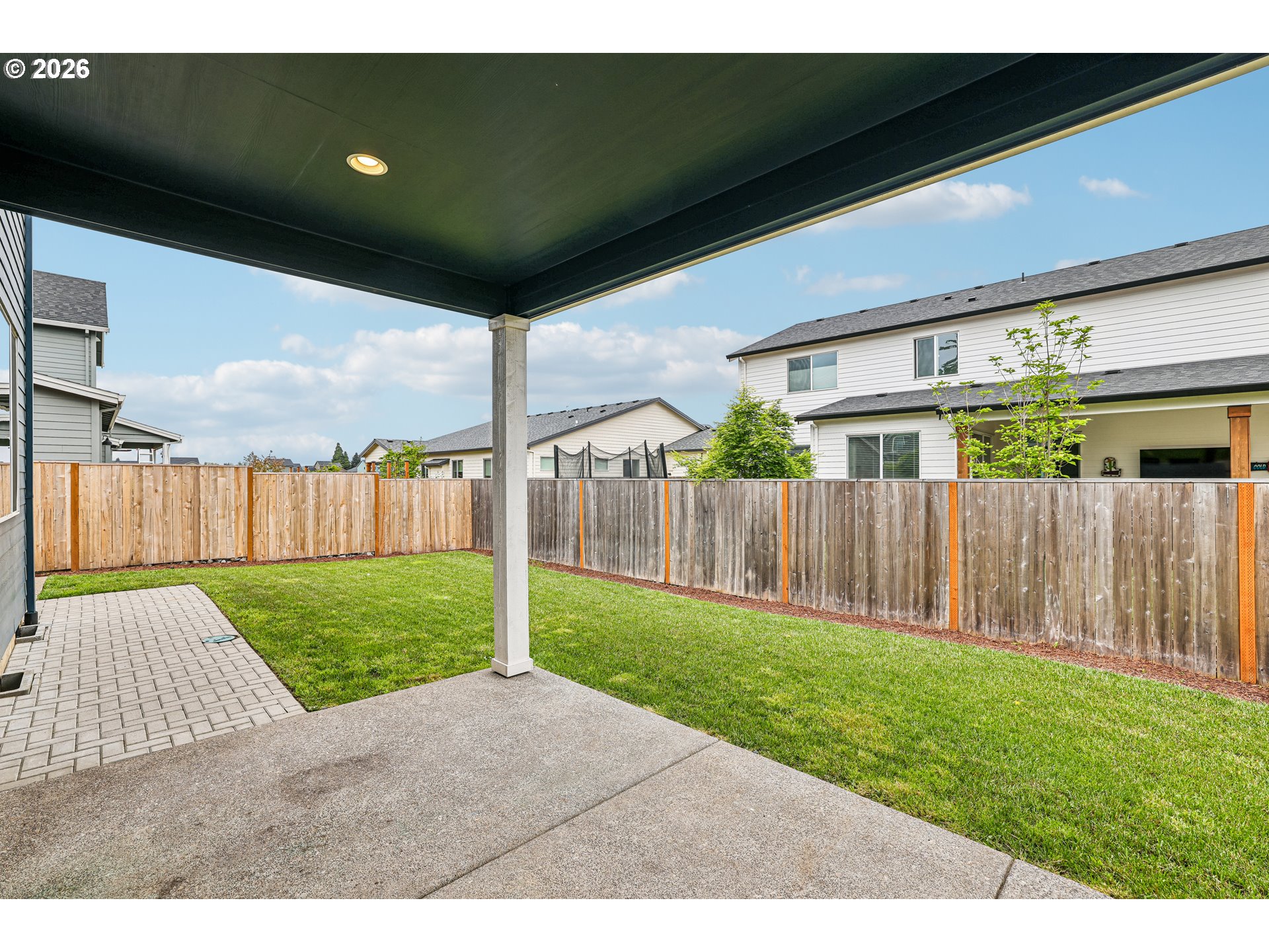 236 Northeast 17th Avenue Canby, OR 97013 - Photo 32 of 36 a view of a backyard with wooden fence