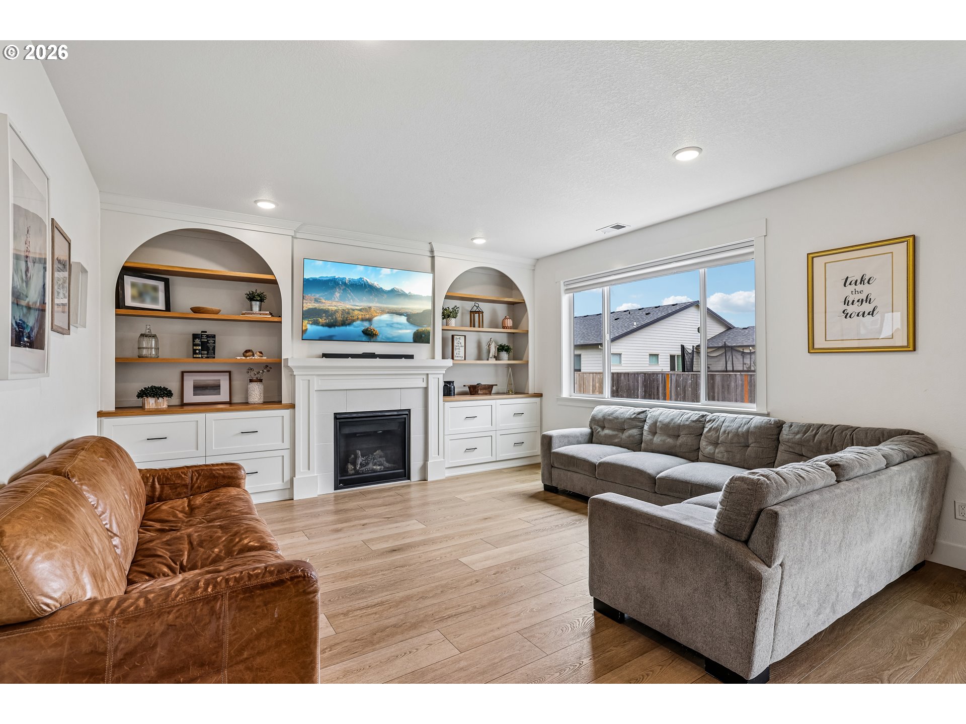 236 Northeast 17th Avenue Canby, OR 97013 - Photo 6 of 36 a living room with furniture and a fireplace