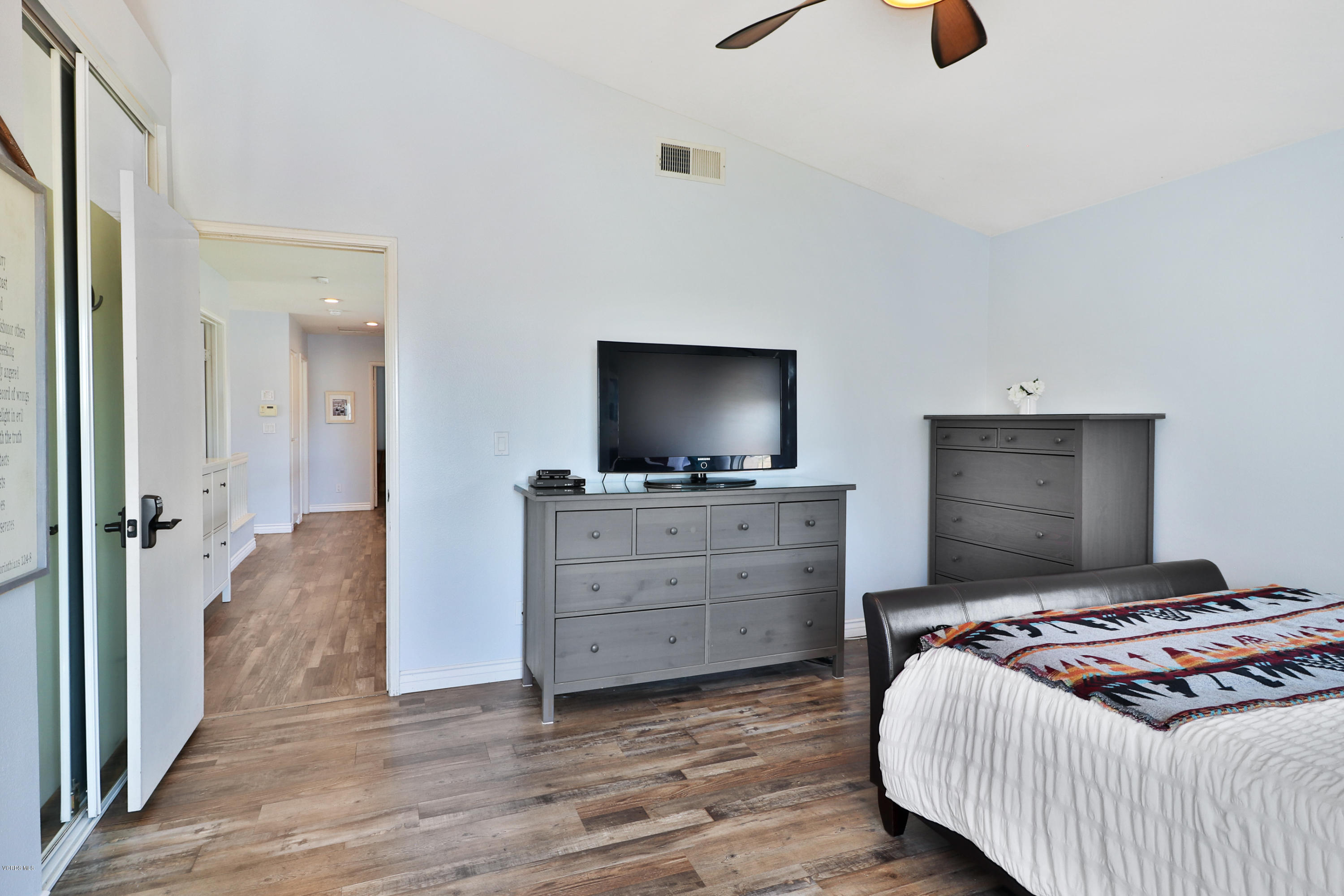 1729 Empty Saddle Road Simi Valley, CA 93063 - Photo 20 of 28 a bedroom with a bed and flat screen tv