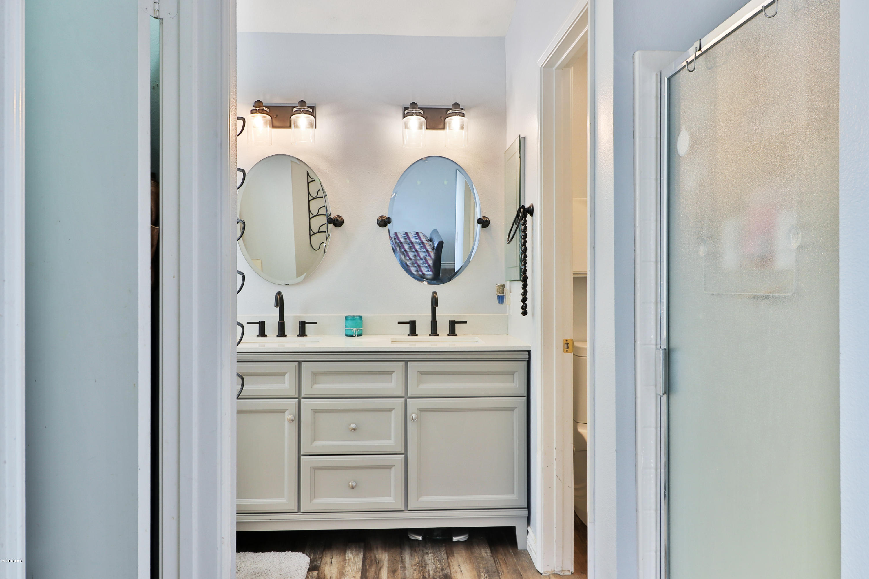 1729 Empty Saddle Road Simi Valley, CA 93063 - Photo 22 of 28 a bathroom with a sink and a mirror