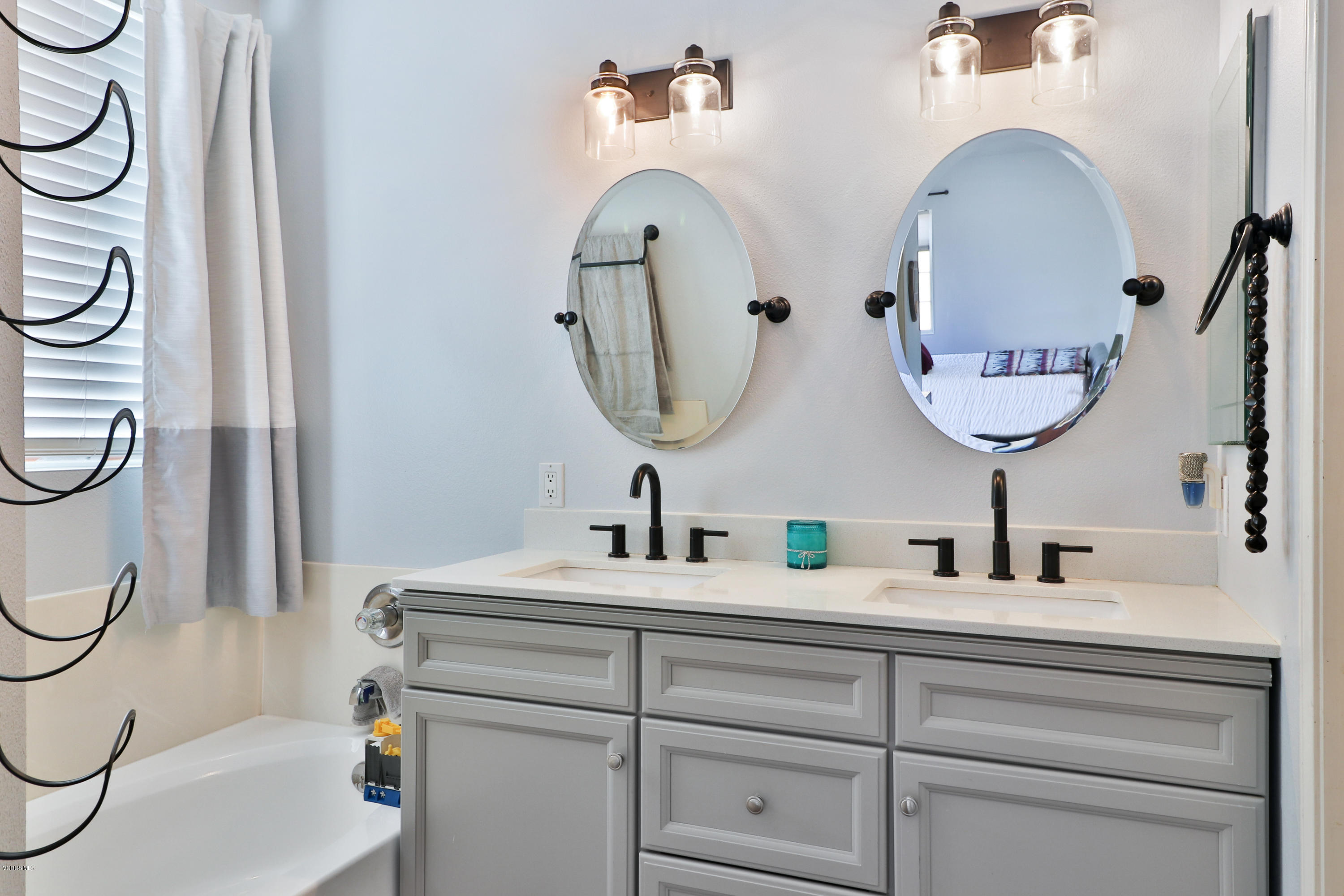 1729 Empty Saddle Road Simi Valley, CA 93063 - Photo 23 of 28 a bathroom with a sink and a mirror