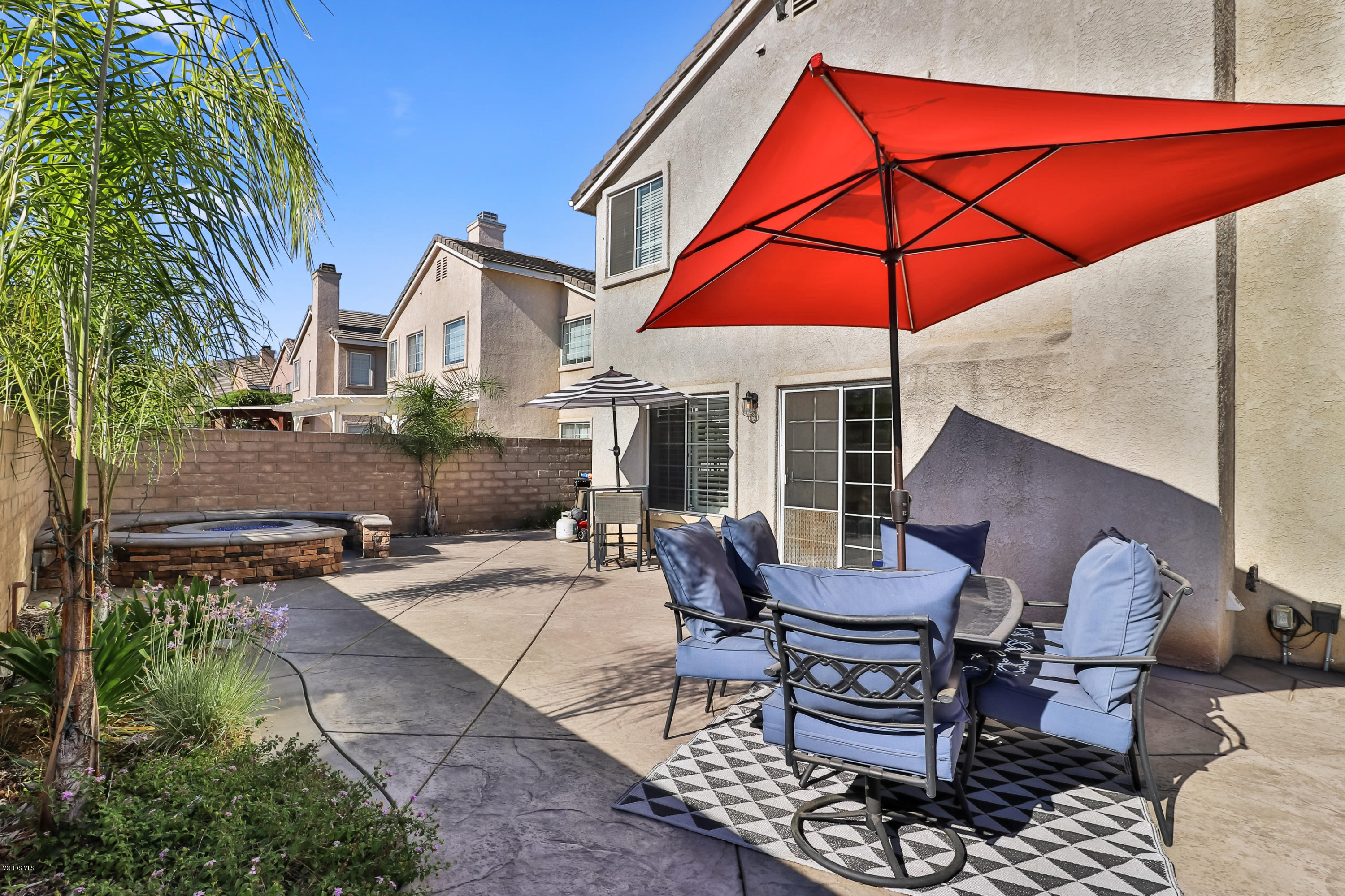 1729 Empty Saddle Road Simi Valley, CA 93063 - Photo 24 of 28 a backyard of a house with table and chairs