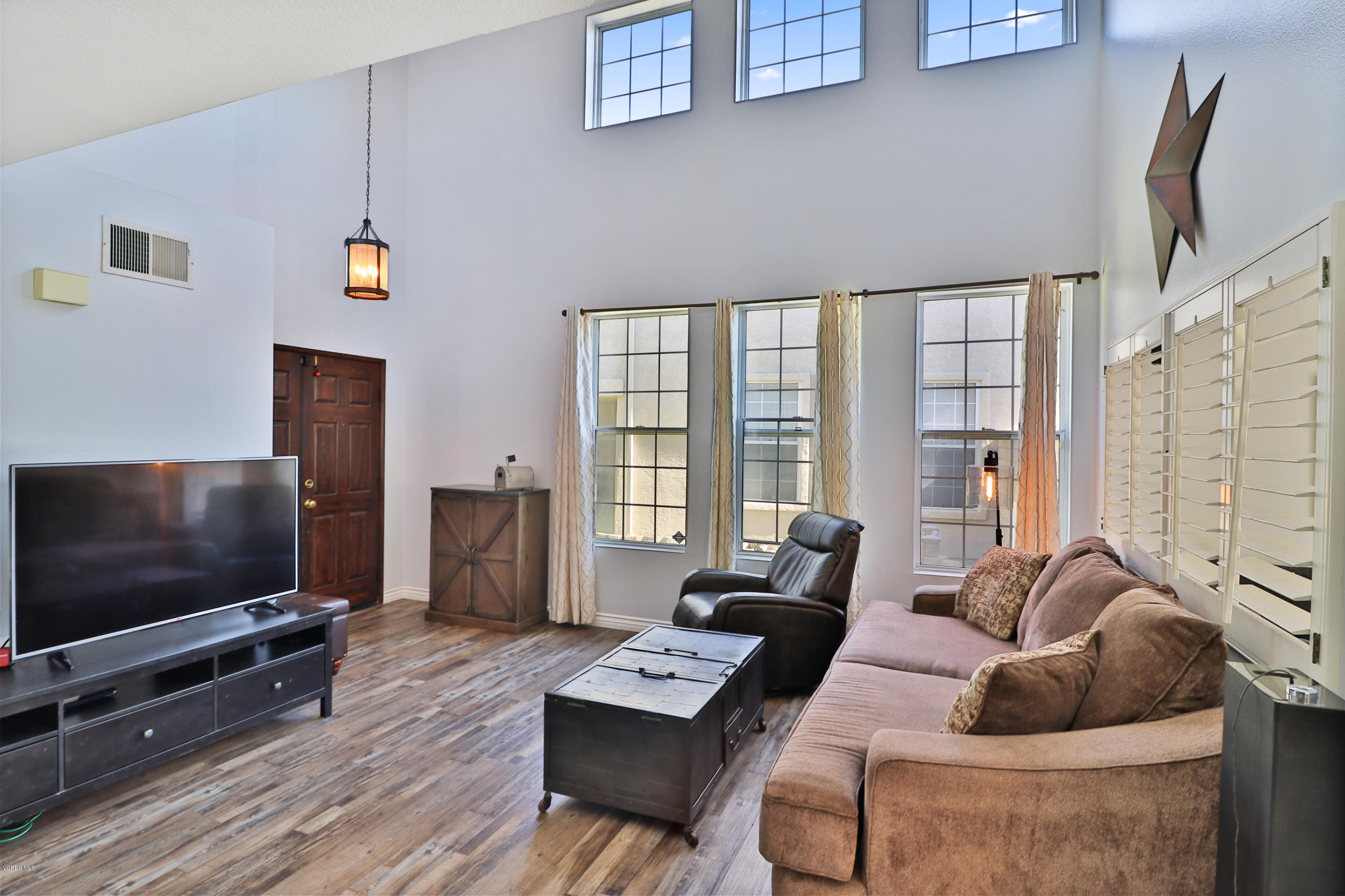 1729 Empty Saddle Road Simi Valley, CA 93063 - Photo 4 of 28 a living room with furniture and a flat screen tv