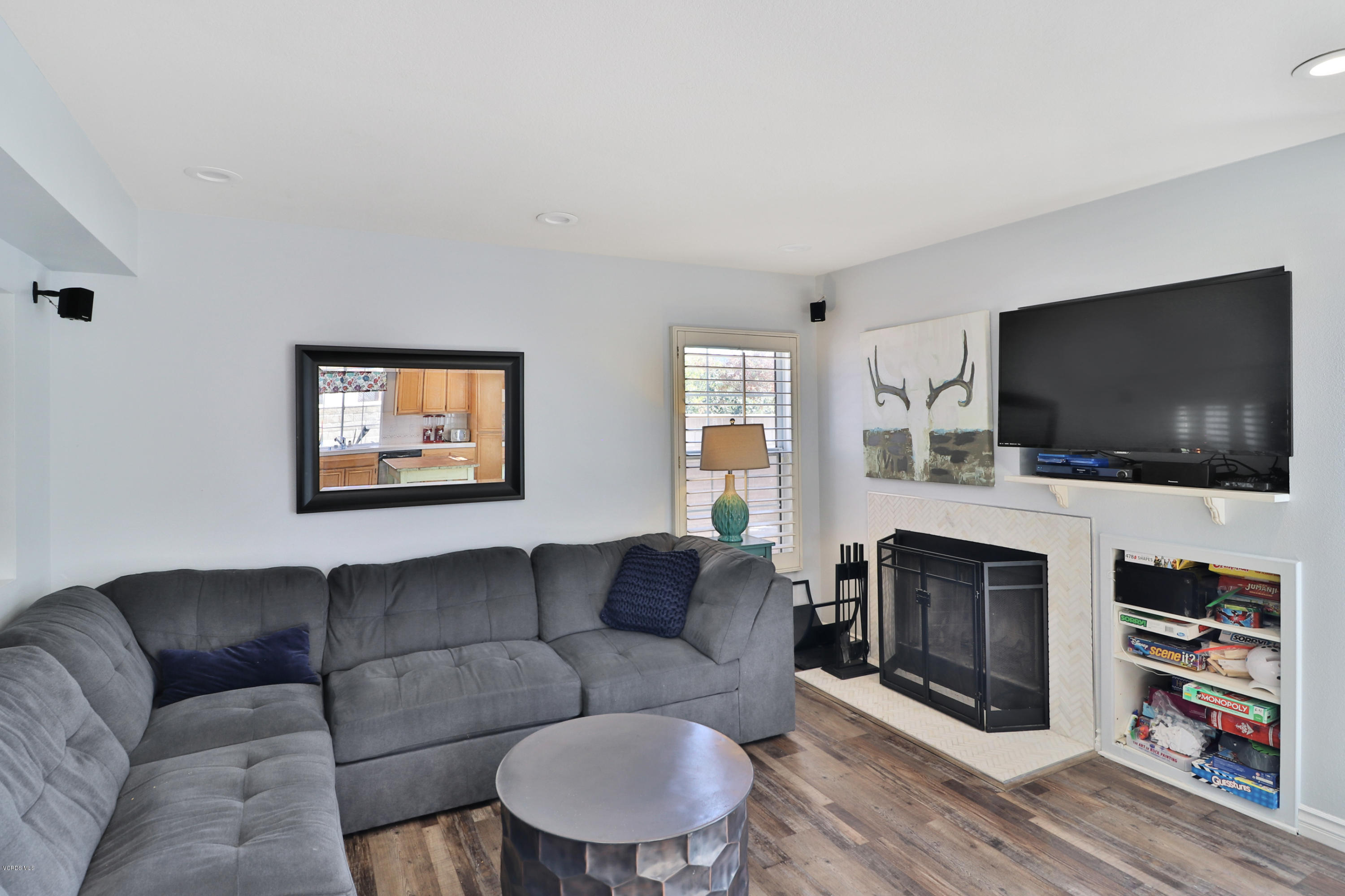 1729 Empty Saddle Road Simi Valley, CA 93063 - Photo 7 of 28 a living room with fireplace furniture and a flat screen tv