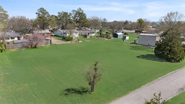 a view of a garden with houses