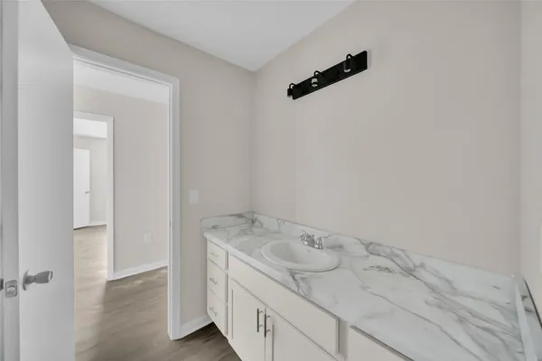 a bathroom with a sink and vanity