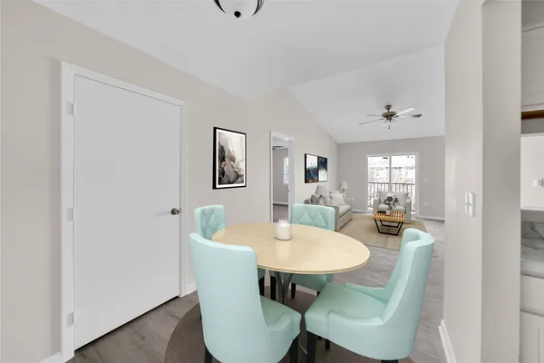a dining room with furniture and window