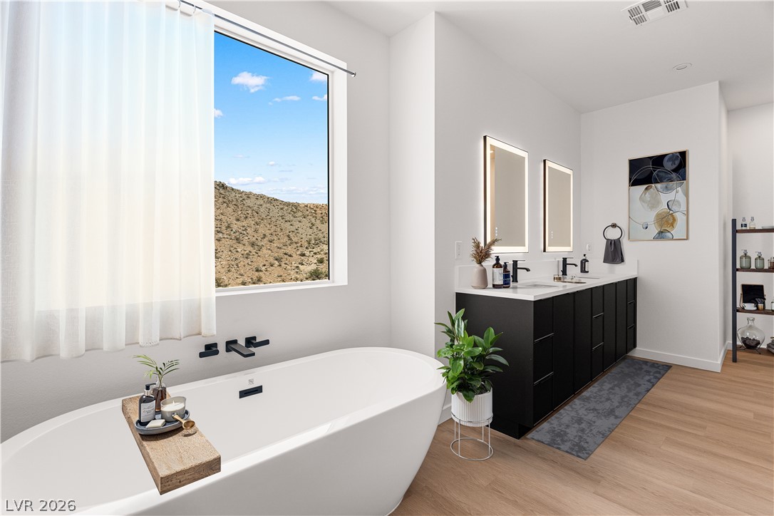 11027 Socrates Ridge Street Las Vegas, NV 89141 - Photo 7 of 20 An oasis of tranquility awaits with a freestanding soaking tub offering expansive desert vistas.