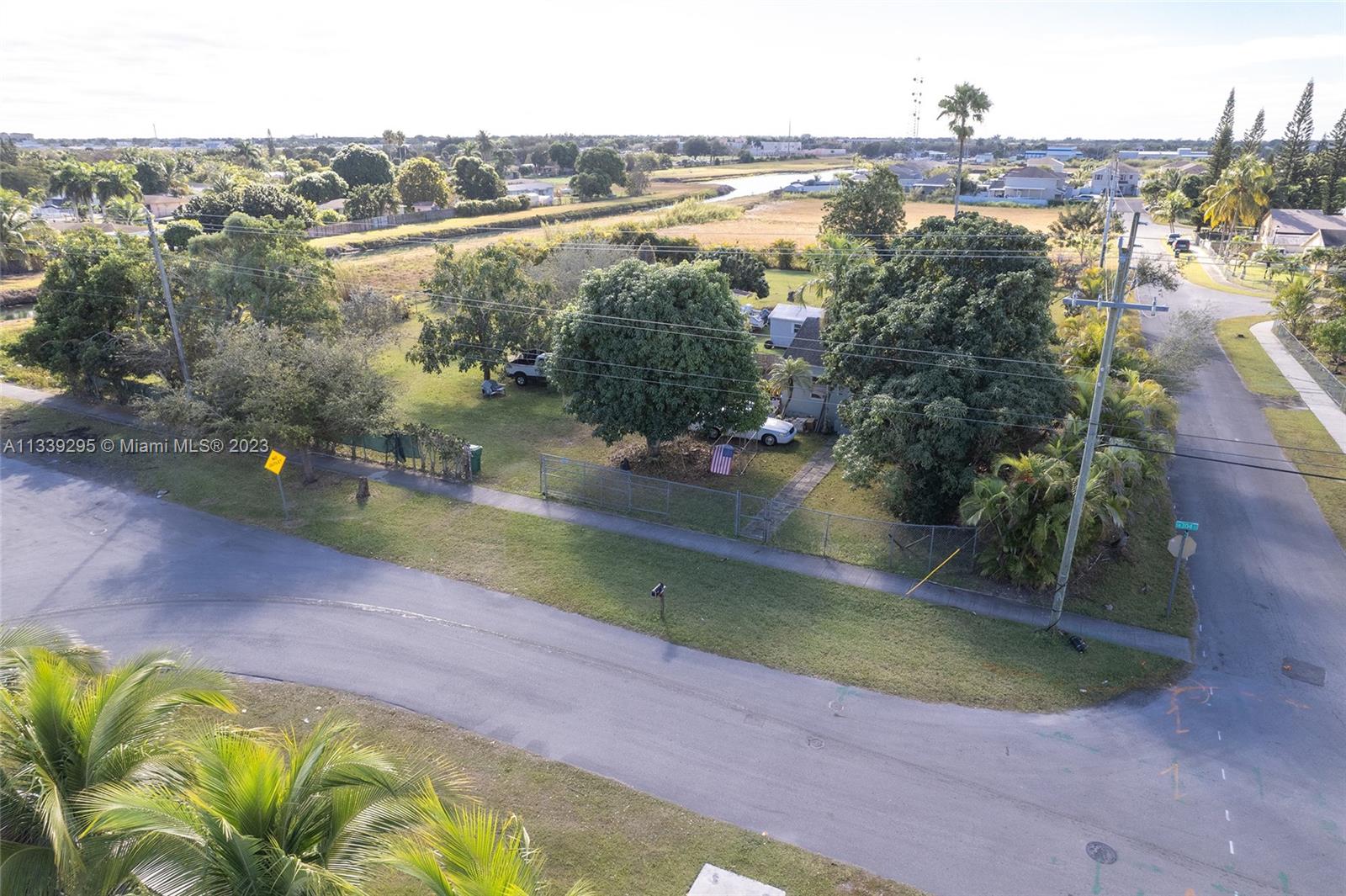 15860 Southwest 304th Street Homestead, FL 33033 - Photo 2 of 7 an aerial view of residential houses with outdoor space and swimming pool