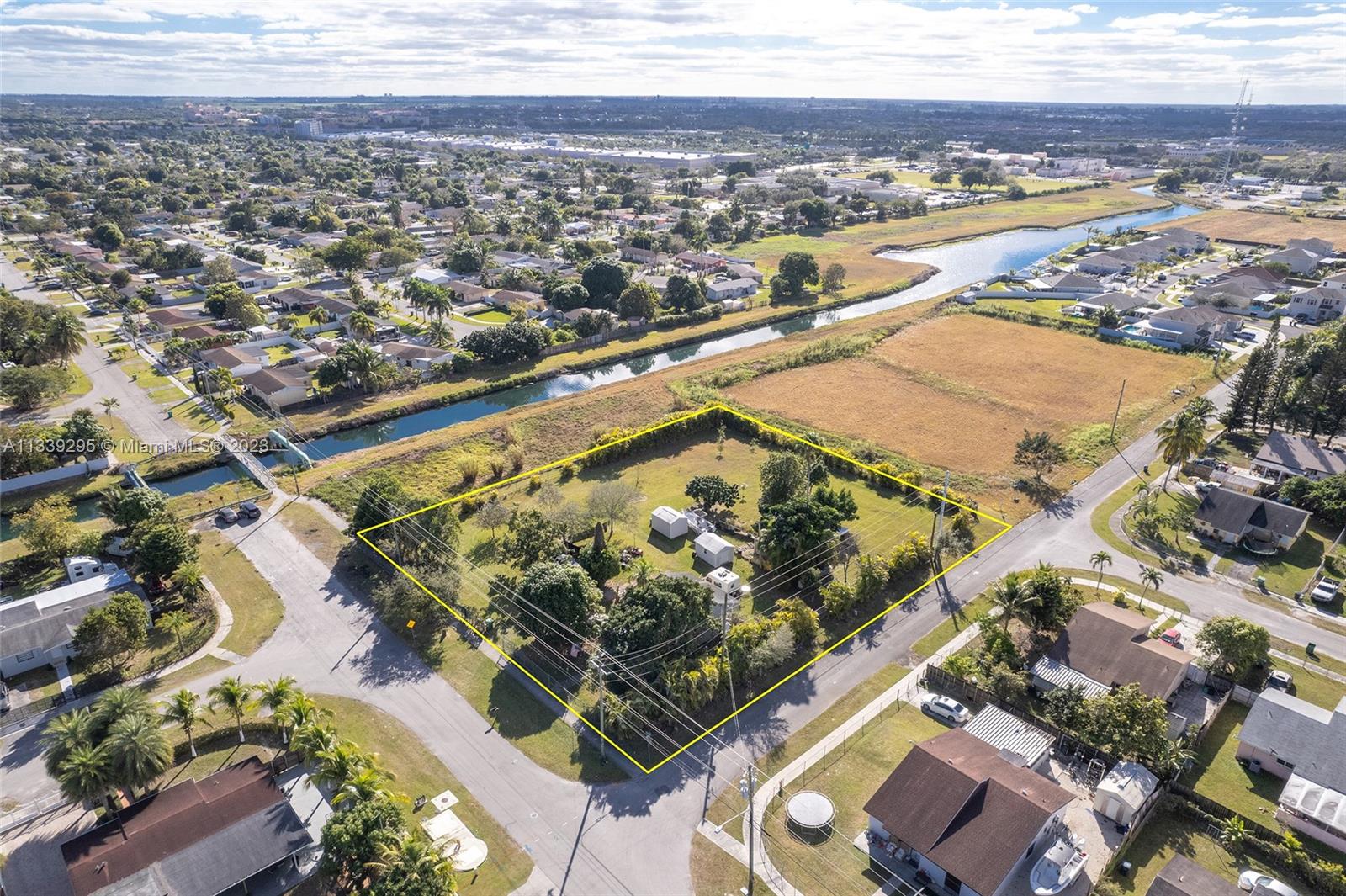 15860 Southwest 304th Street Homestead, FL 33033 - Photo 5 of 7 an aerial view of residential houses with outdoor space