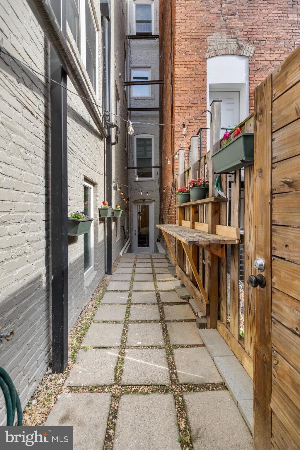 1324 W Street Northwest, Unit 1 Washington, DC 20009 - Photo 34 of 37 a view of a brick buildings with many windows