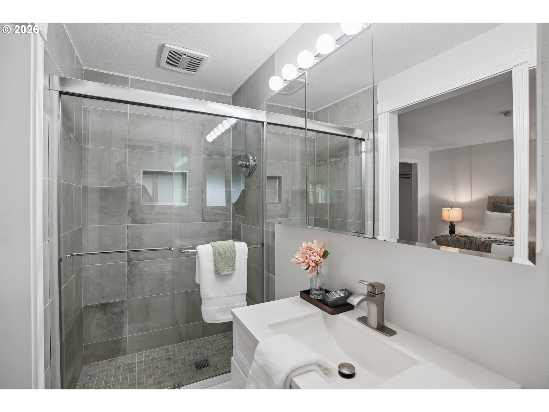 992 South South End Road Oregon City, OR 97045 - Photo 18 of 38 a bathroom with a sink mirror and shower