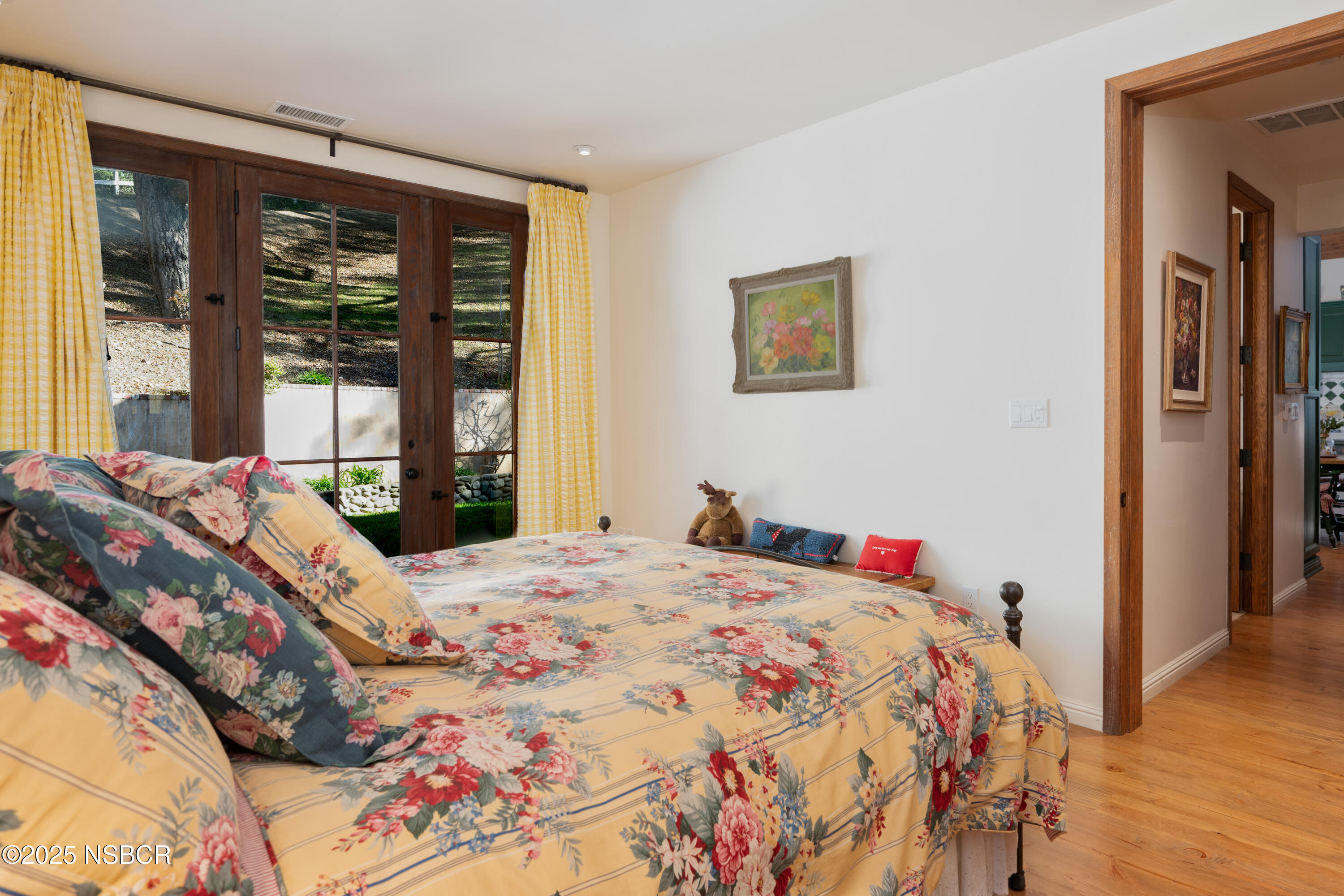 4086 East Oak Trail Road Santa Ynez, CA 93460 - Photo 35 of 57 a bedroom with a bed and a large window