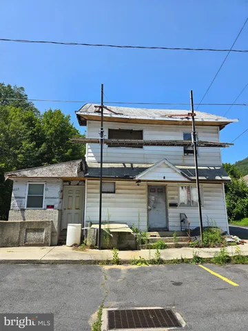 a view of a house with a street