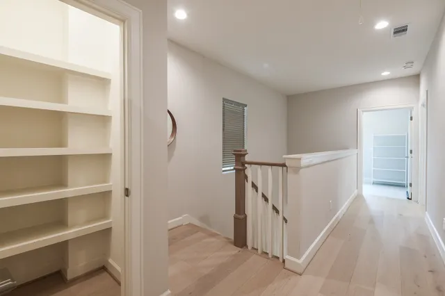 a view of a hallway with closet