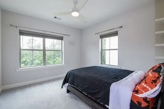 a bedroom with a bed and window