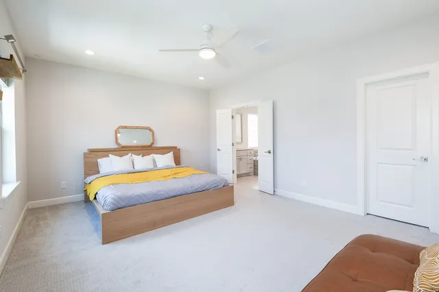 a bedroom with bed and window