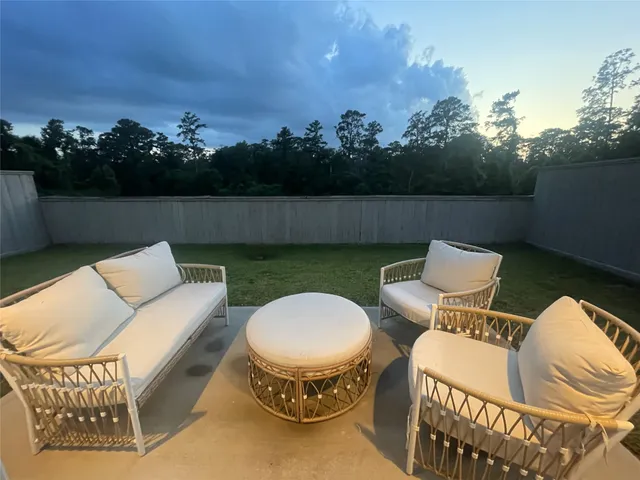 a view of a patio in back of a house