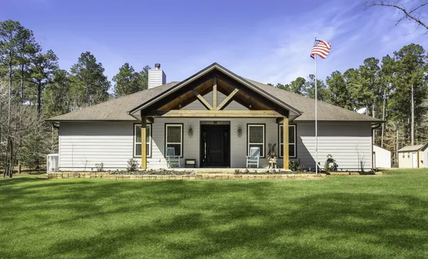 a front view of house with yard and green space
