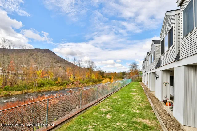 a view of swimming pool with a yard
