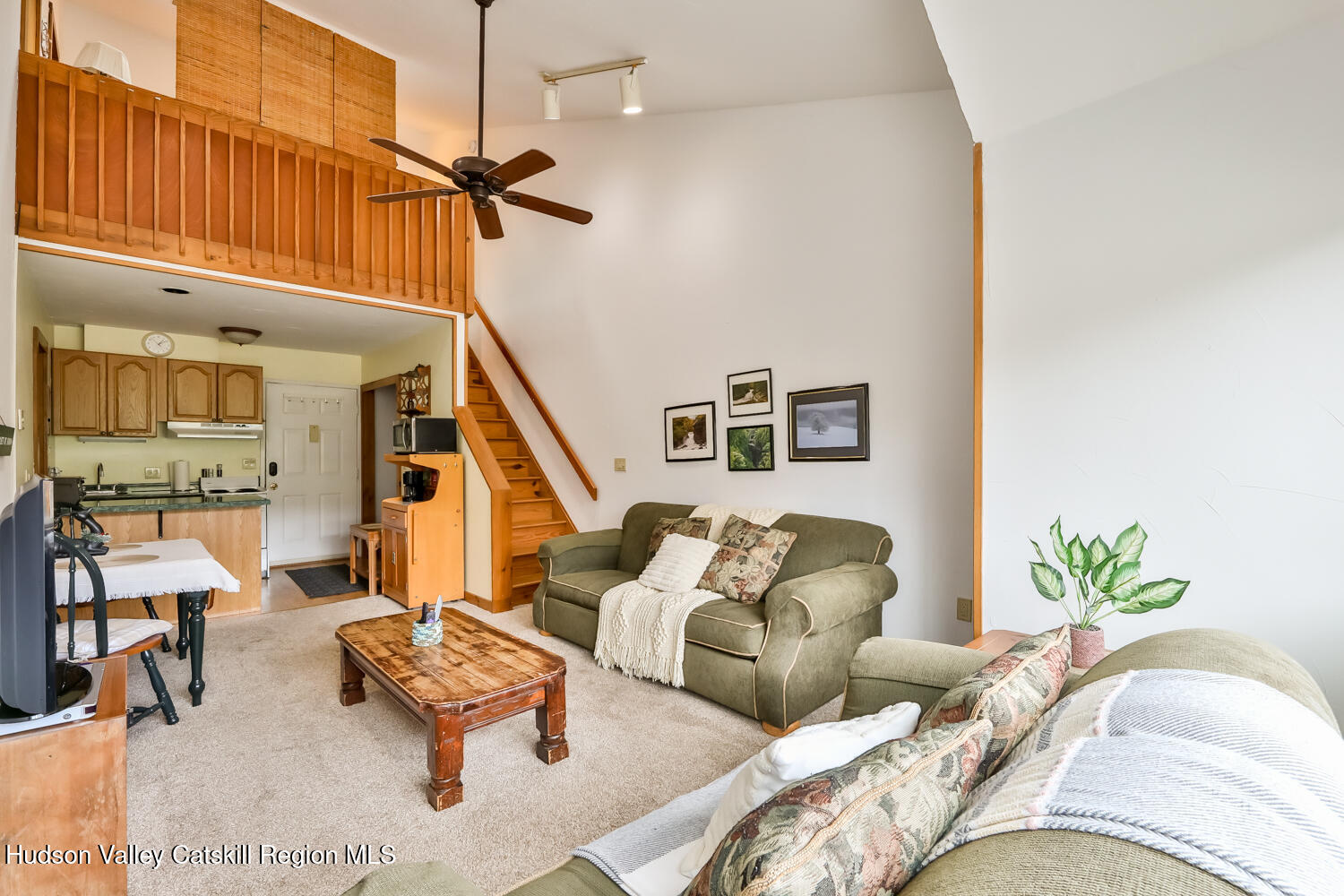 7675 Main Street, Unit B14 Hunter, NY 12442 - Photo 8 of 18 a living room with furniture and wooden floor