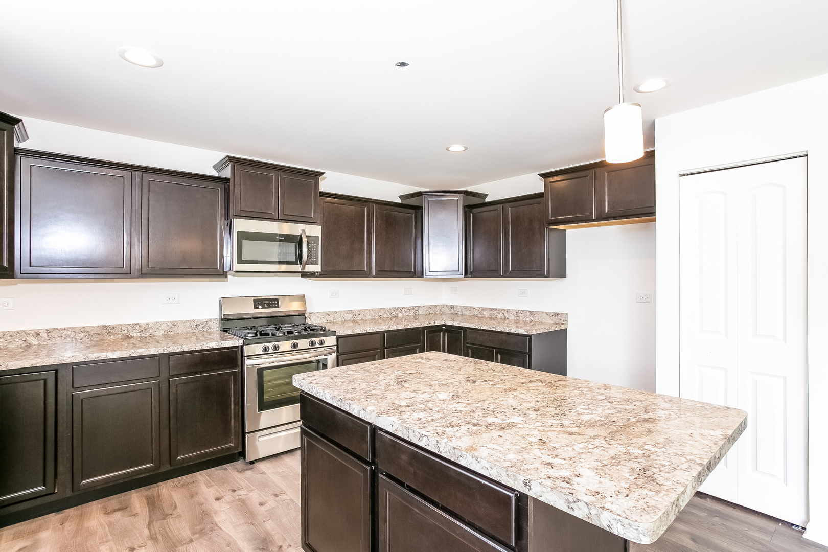1978 Stapleton Road New Lenox, IL 60451 - Photo 23 of 48 a kitchen with stainless steel appliances granite countertop a sink stove and refrigerator