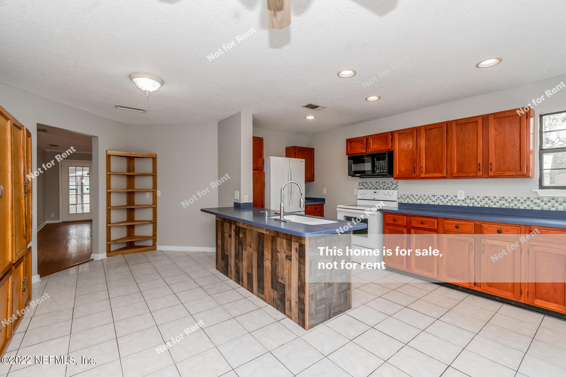 4205 Mustang Road Middleburg, FL 32068 - Photo 12 of 27 a kitchen with stainless steel appliances granite countertop a stove and a sink