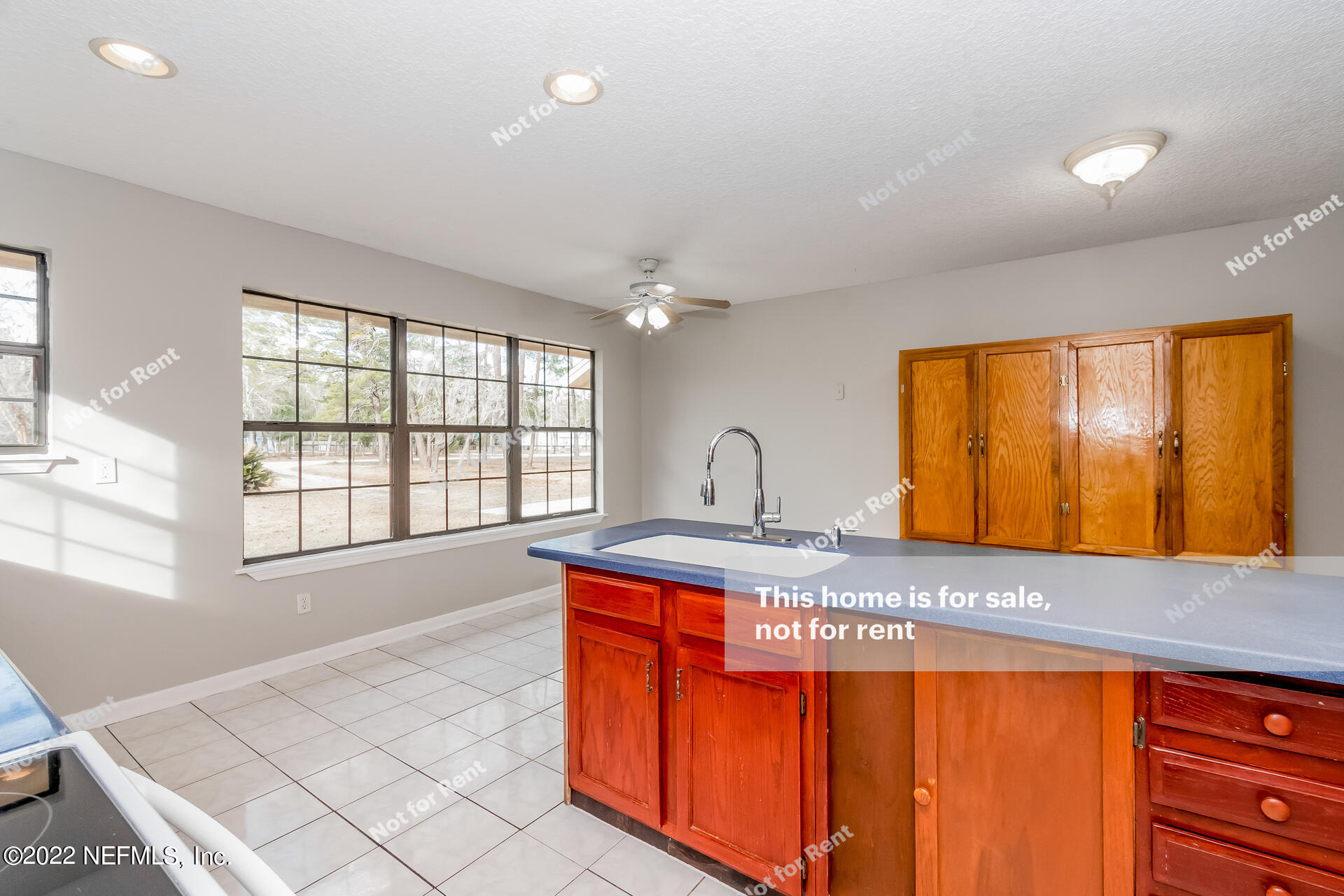4205 Mustang Road Middleburg, FL 32068 - Photo 14 of 27 a spacious bathroom with a granite countertop sink and a large mirror