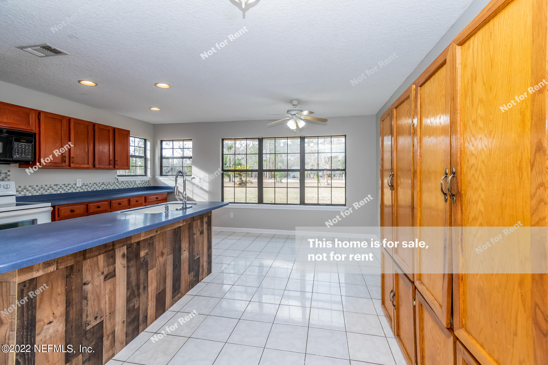 4205 Mustang Road Middleburg, FL 32068 - Photo 15 of 27 a kitchen with stainless steel appliances granite countertop a refrigerator and a stove