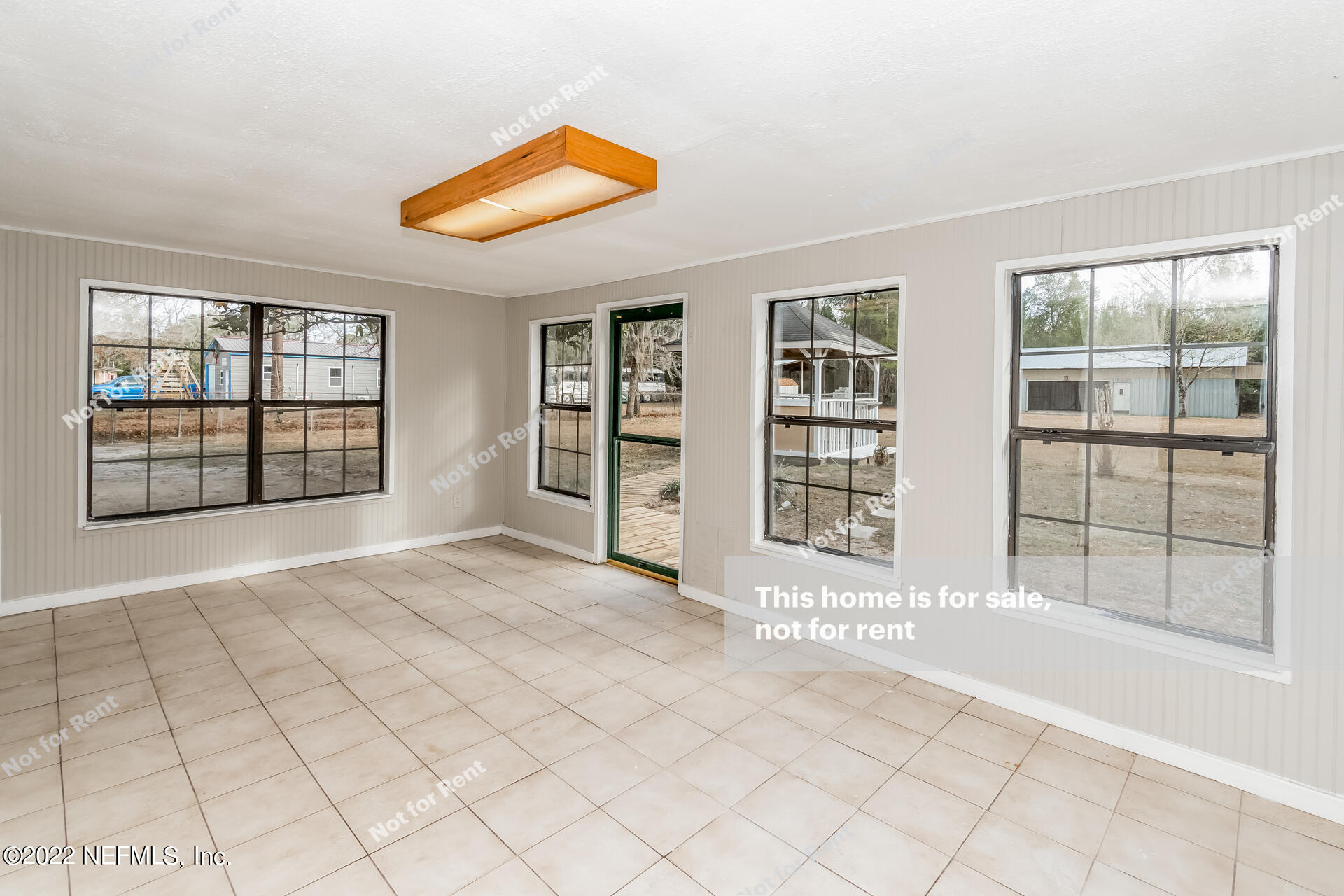 4205 Mustang Road Middleburg, FL 32068 - Photo 17 of 27 a view of an empty room with a window and balcony