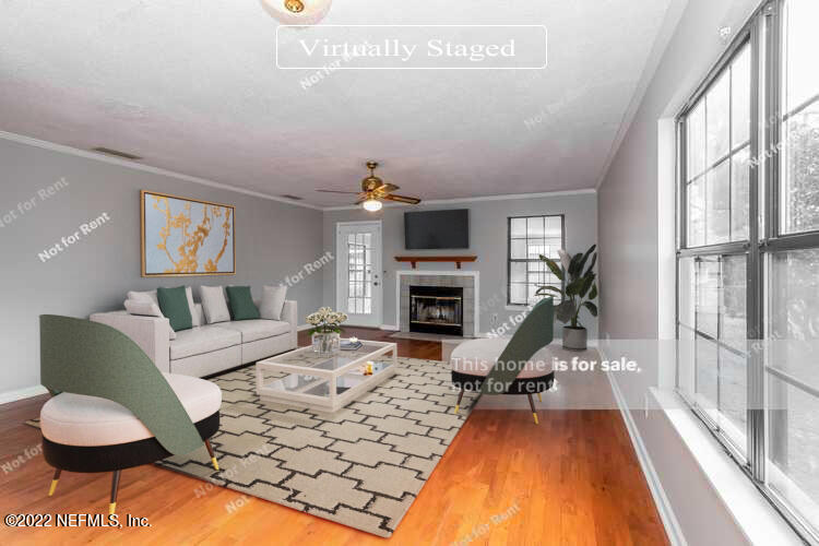 4205 Mustang Road Middleburg, FL 32068 - Photo 2 of 27 a living room with furniture a large window and a dining table