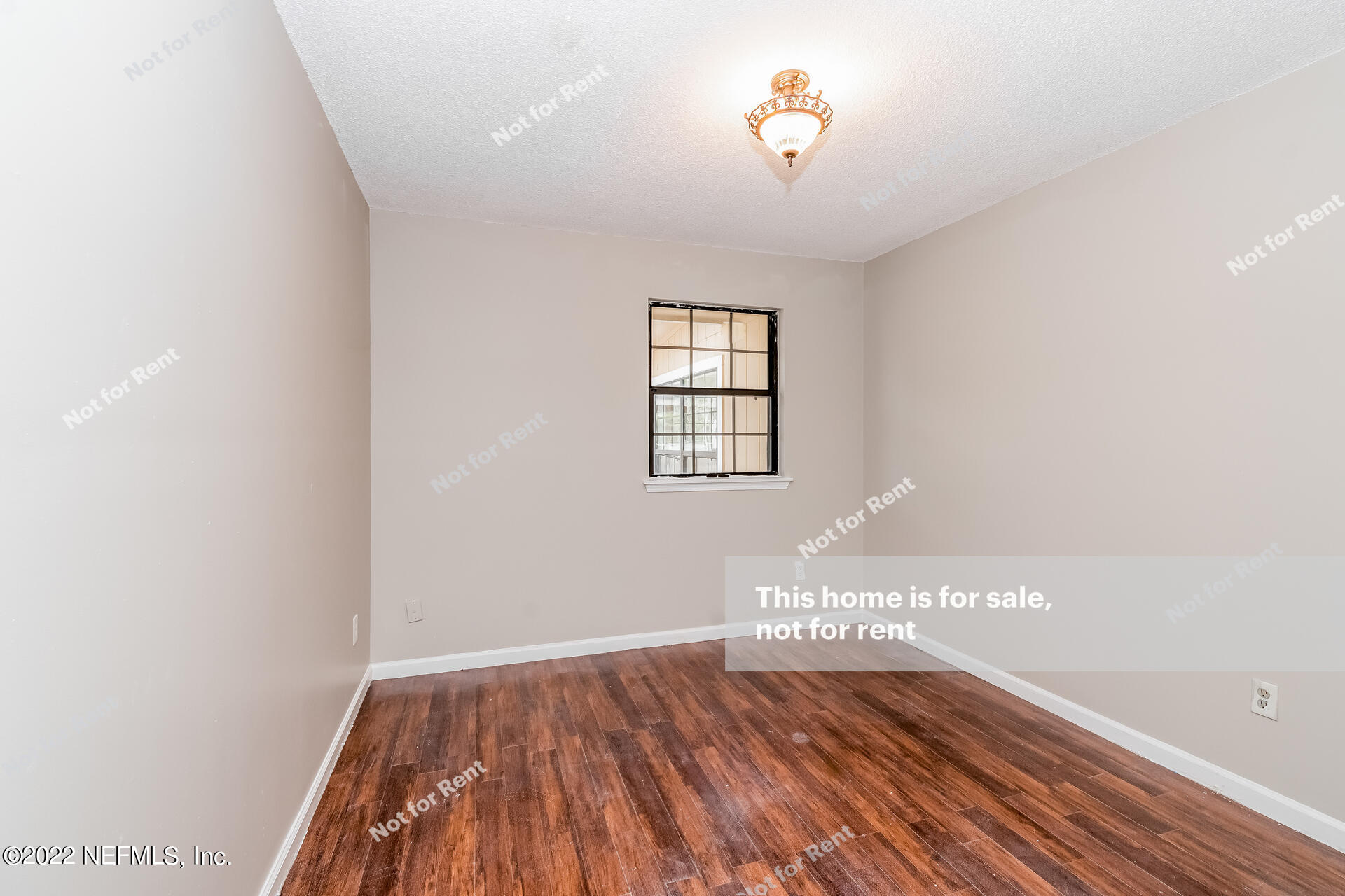 4205 Mustang Road Middleburg, FL 32068 - Photo 23 of 27 wooden floor in an empty room with a window