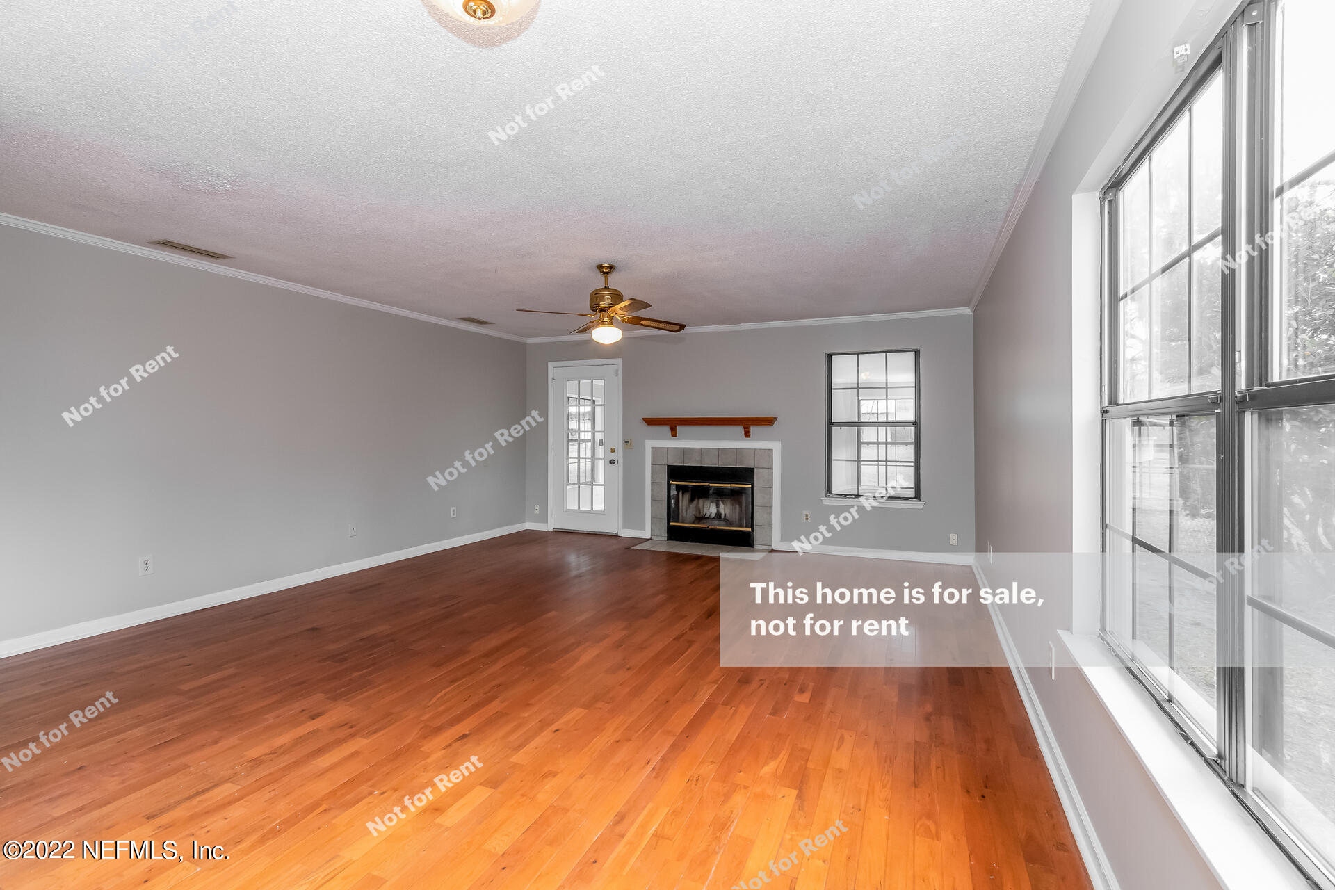 4205 Mustang Road Middleburg, FL 32068 - Photo 5 of 27 a view of an empty room with a fireplace and a window