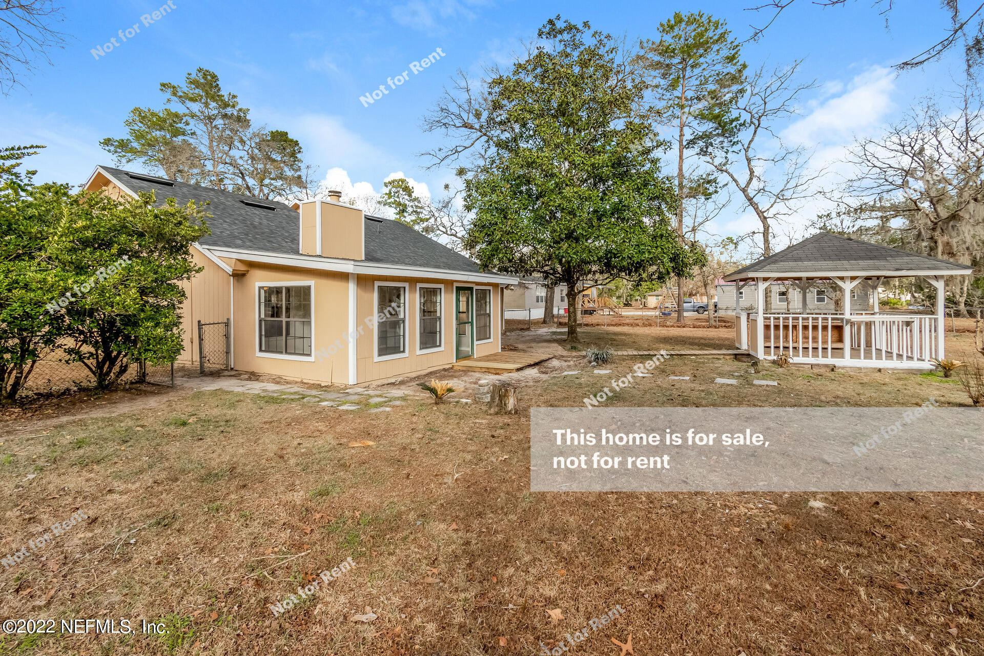 4205 Mustang Road Middleburg, FL 32068 - Photo 7 of 27 a front view of a house with a yard and garage