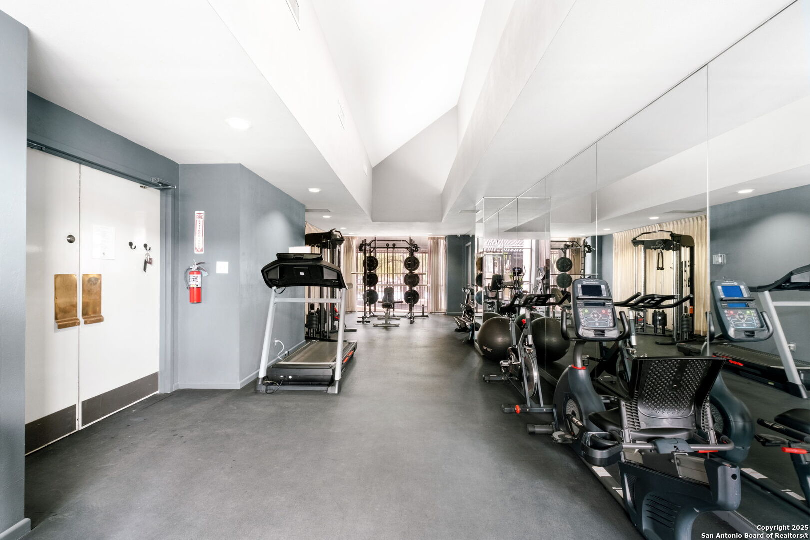 7701 Wurzbach Road, Unit 907 San Antonio, TX 78229 - Photo 21 of 25 a view of a room with gym equipment