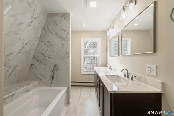 a bathroom with a sink and a bathtub