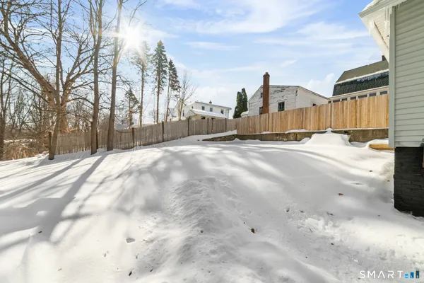 a view of a house with a snow on the road