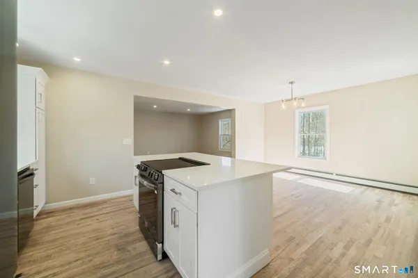 a view of kitchen with wooden floor
